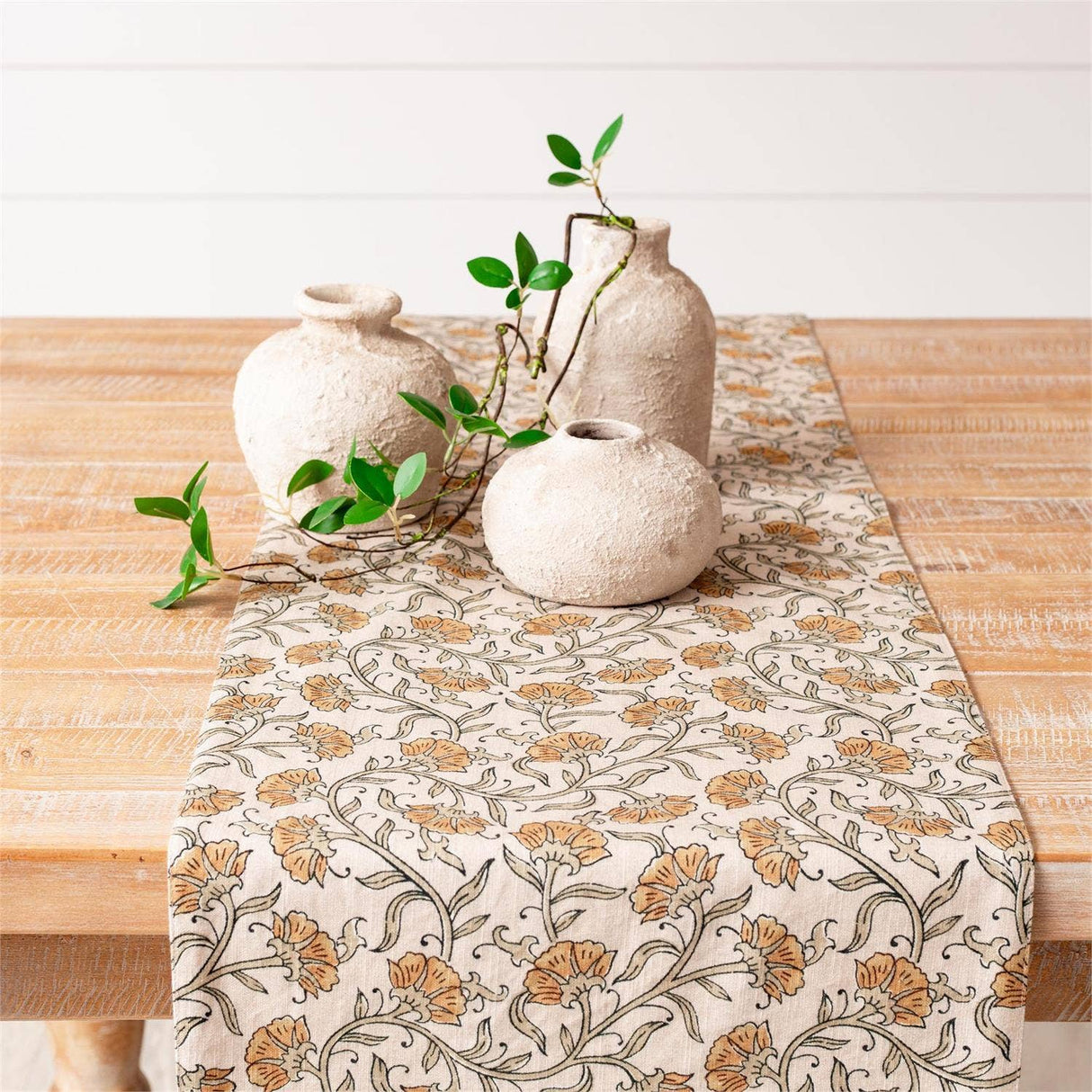 Block print dandelion table runner styled in a home decor vignette from Magnolias Home Decor