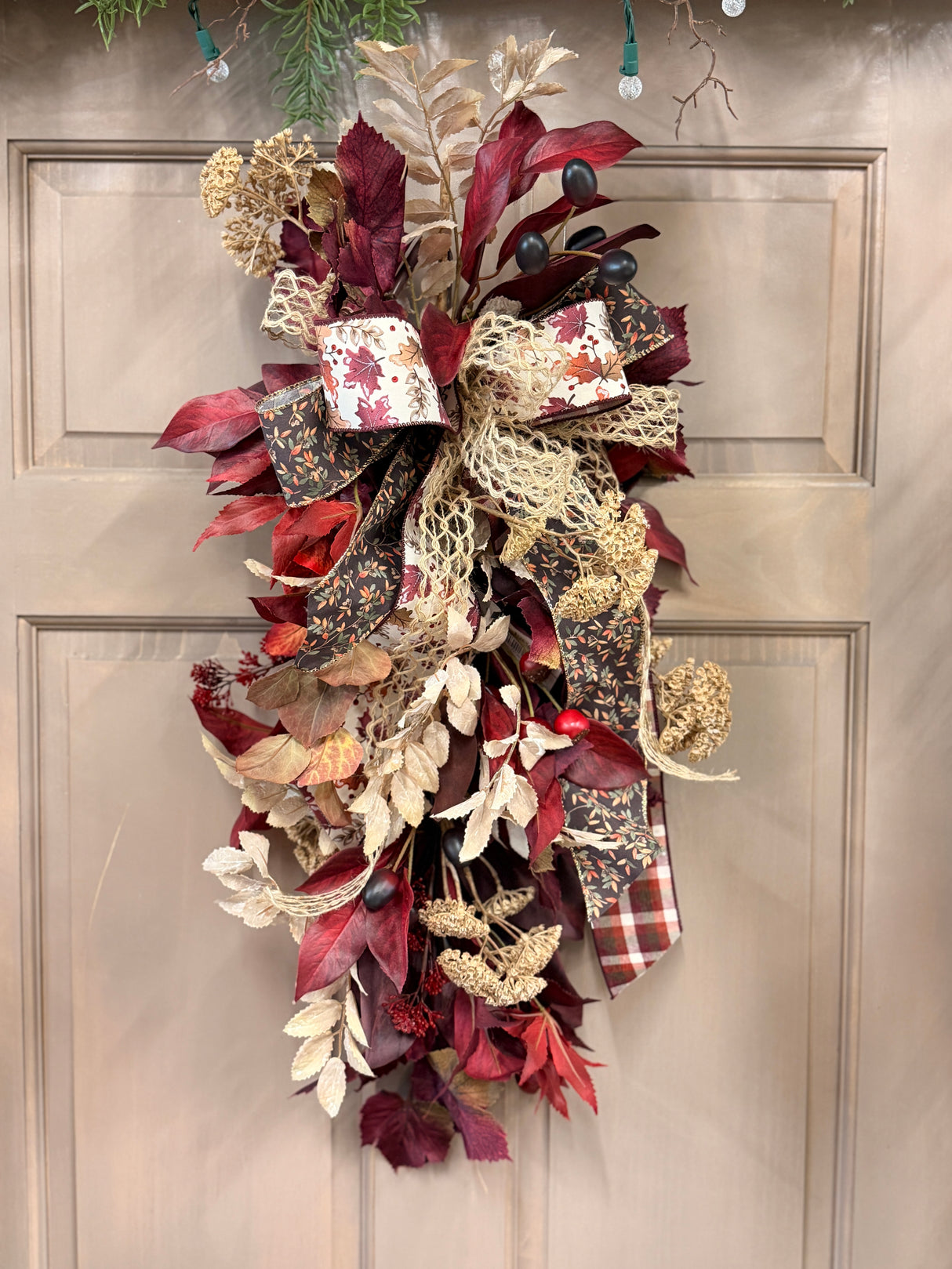 Silk floral burgundy rust burgundy contrast teardrop swag 29 inch handmade for traditional fall home decor from Magnolias Home Decor