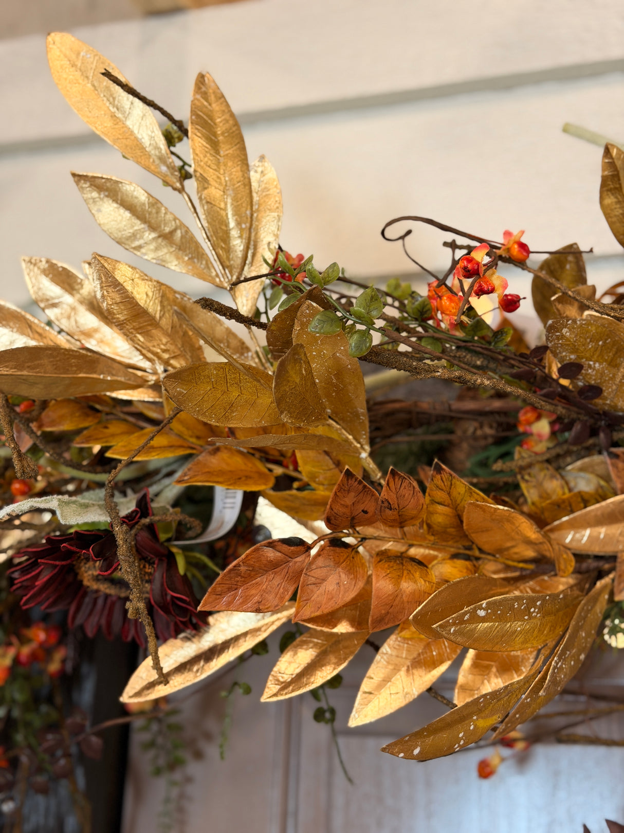 Close-up of gold brown laurel & ruscus leaf garland detail from Magnolias Home Decor