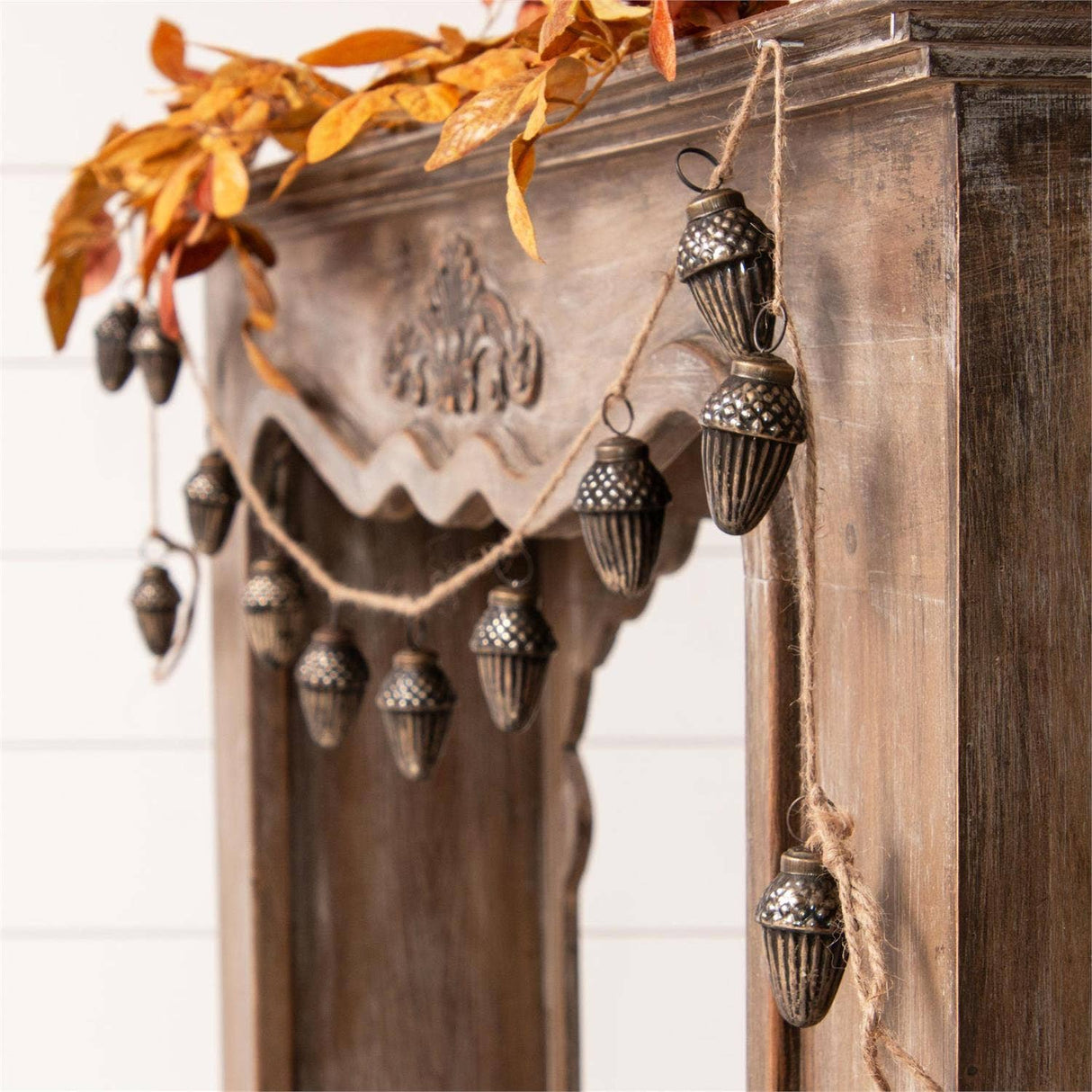 Close-up of 71" antiqued glass acorns garland detail from Magnolias Home Decor