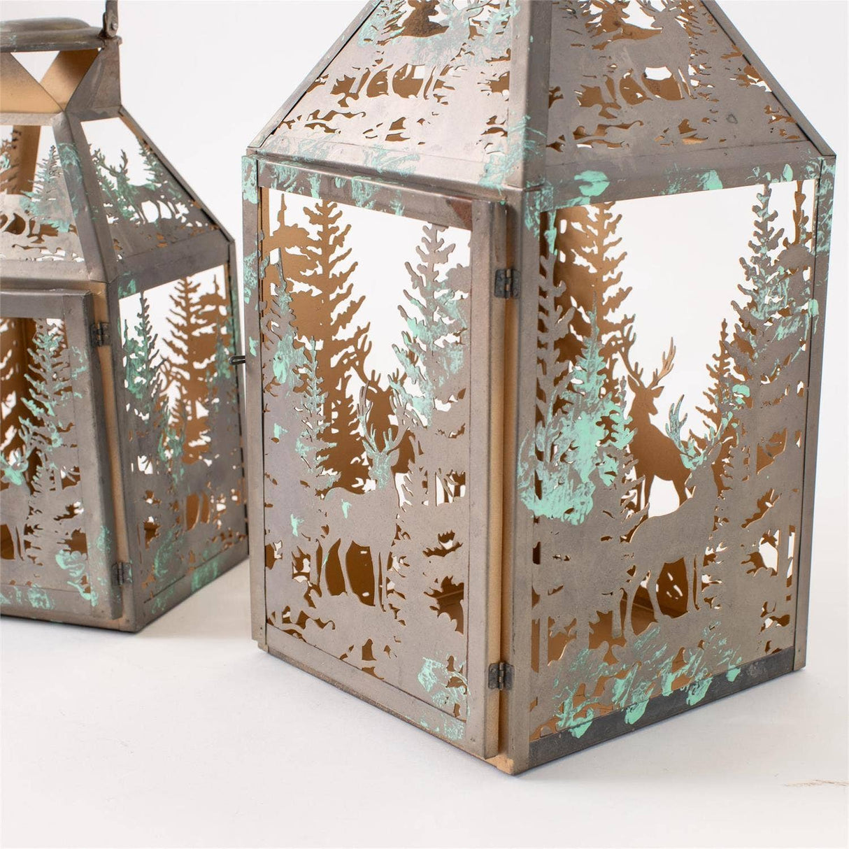 Woodland deer antiqued metal lantern styled in a home decor vignette from Magnolias Home Decor